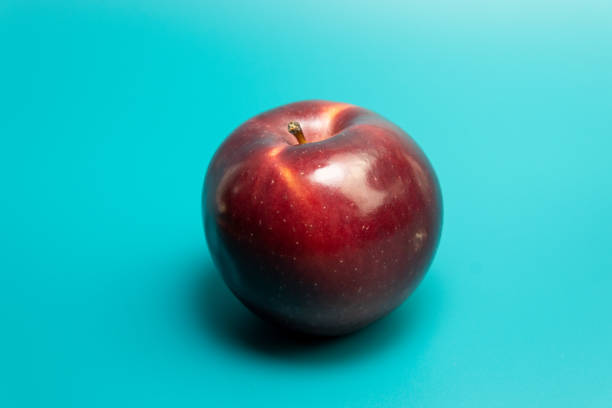istock Healthy fresh red apple on blue background 1337314599
