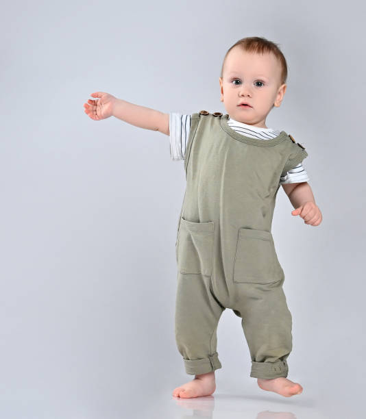 istock First steps of baby isolated on white background 1337318153