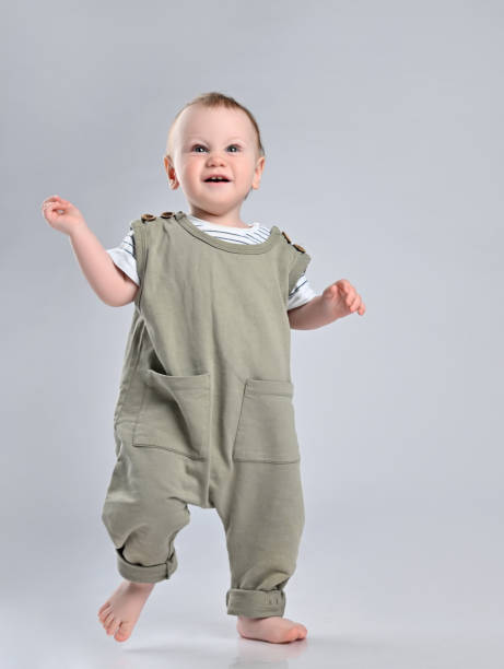 istock First steps of baby isolated on white background 1337318167