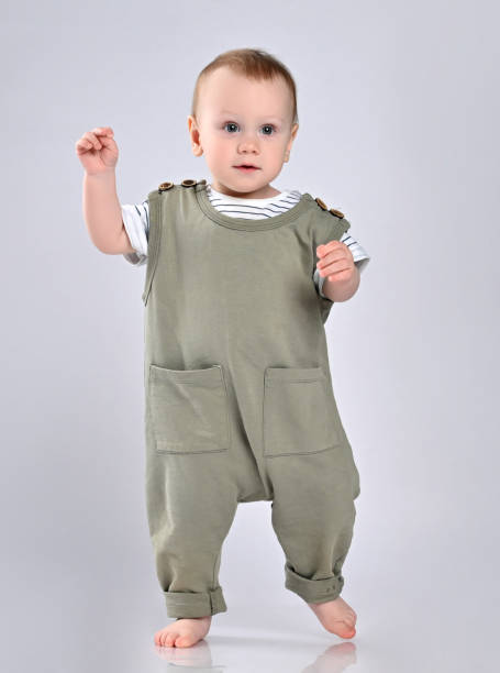 istock First steps of baby isolated on white background 1337318247