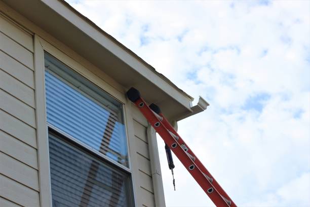 istock Installing roof gutters for a residential house 1337318278