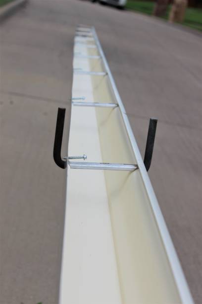 istock Installing roof gutters for a residential house 1337320361