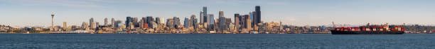 istock Large Panoramic View of Seattle Skyline with Mostly Clear Skies and Large Boat 1337321029