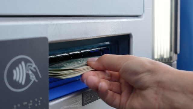 Withdrawn Money Dollars out of ATM machine