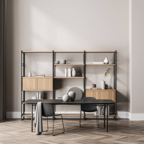 istock Bookshelf in the beige waiting room with table, chairs 1337323486