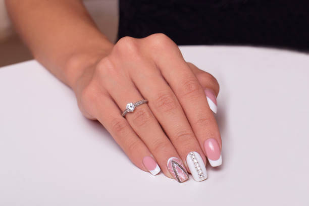 istock Female hand with wedding manicure nails 1337324834
