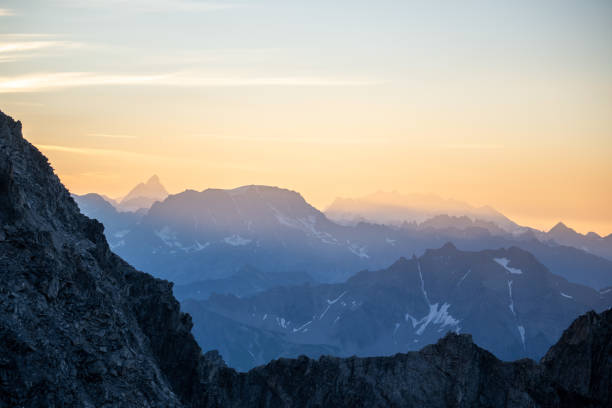 istock Scenic view of snowcapped mountains at dawn 1337329814