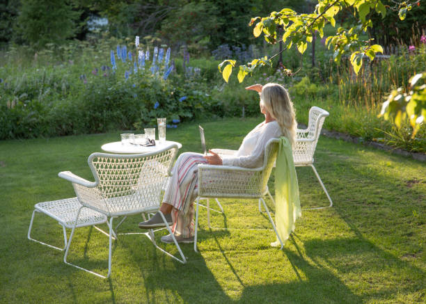 istock Woman relaxes in a garden setting 1337332181