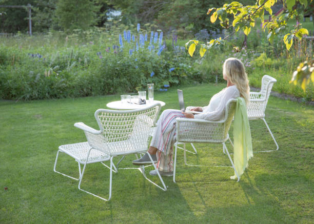 istock Woman relaxes in a garden setting 1337332182