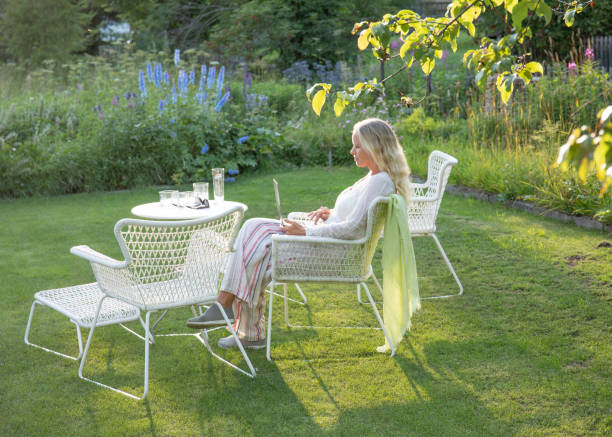 istock Woman relaxes in a garden setting 1337332212