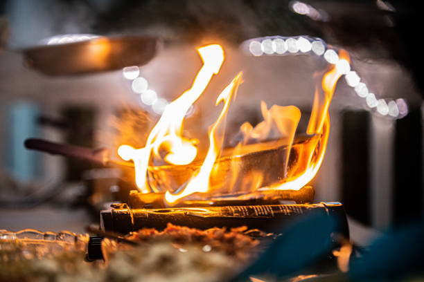 istock Copper pan engulfed in flames on cooking burner at outdoor resort buffet 1337332269
