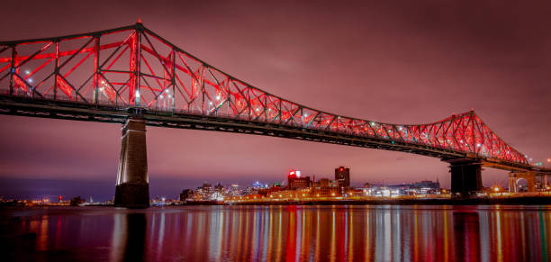 Jacques Cartier Bridge illuminated in red, Montreal, Quebec, Canada.