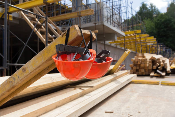 istock Construction helmets at a construction site. Construction helmet for head protection. Overalls. Helmets 1337335692