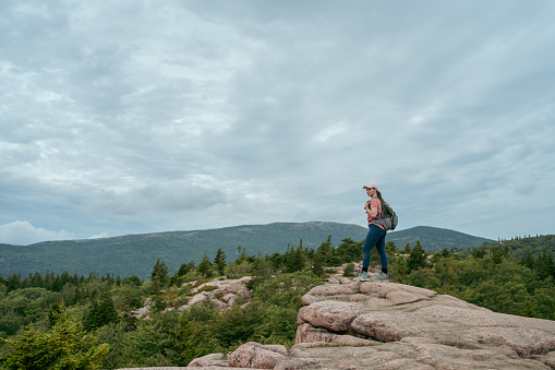 Lonely woman hiking in Acadia National Park