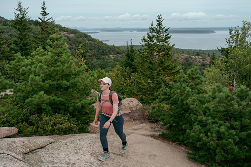 Lonely woman hiking in Acadia National Park