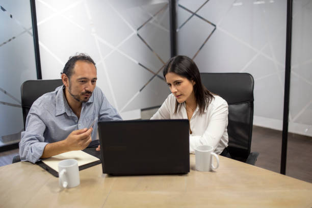 istock Man and woman working in office 1337339912