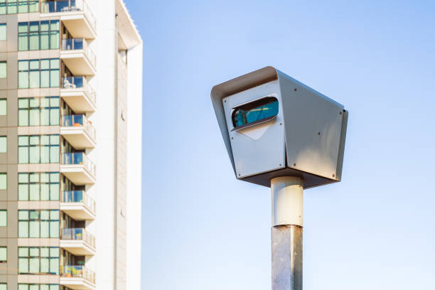 Modern red light and speed camera Modern stationary red light and speed camera in Adelaide city on a day speed limit sign australia stock pictures, royalty-free photos & images