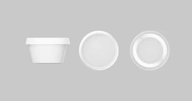 Photo of 3D white and black round container for cream, butter, melted cheese or margarine spread. Perspective view isolated on gray background. Packaging mockup image.