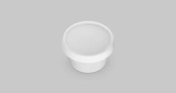 Photo of 3D white and black round container for cream, butter, melted cheese or margarine spread. Perspective view isolated on gray background. Packaging mockup image.