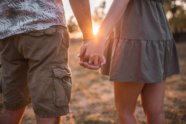 istock Lovely young couple holding hands 1337347256