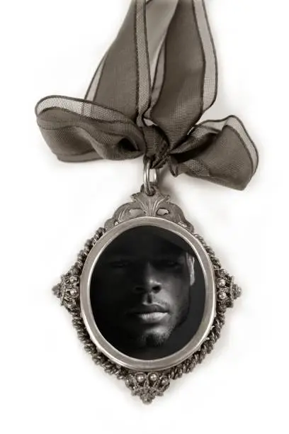 Cameo silver locket with african male shadow low key portrait