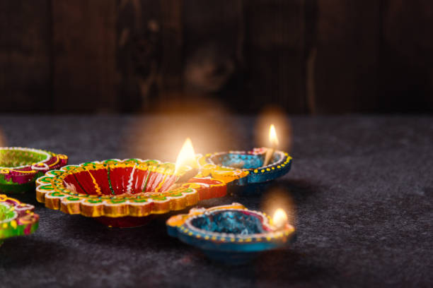 istock clay lit light a fire already on Diya or oil lamp 1337358614