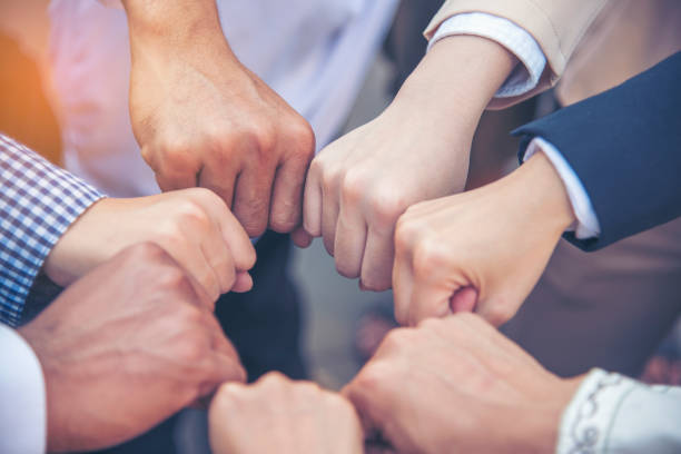 istock Diverse multiethnic Partners hands together teamwork group of multi racial people meeting join hands togetherness. Diversity people hands join empower partnership teams connection volunteer community 1337358884