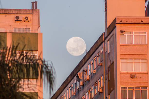 istock full moon over a building on Botafogo beach. 1337359631