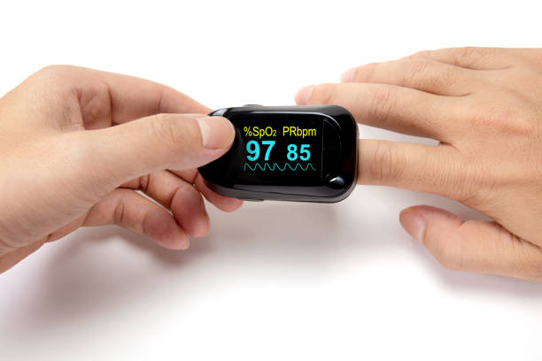 istock Pulse oximeter on the index finger isolated on a white background. 1337360634