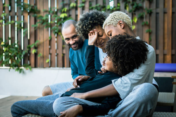 istock Siblings playing together and parents watching 1337360656