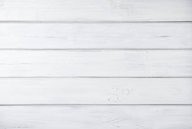 istock White wooden background.Solid wooden wall from weathered cracked boards. Top view and copy space 1337360799