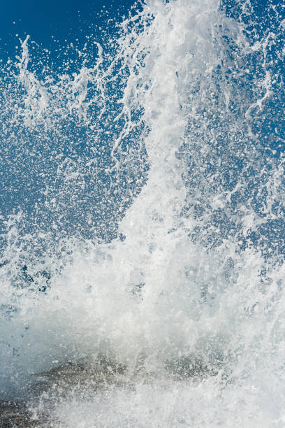 istock sea wave crashes on a concrete pier 1337360986