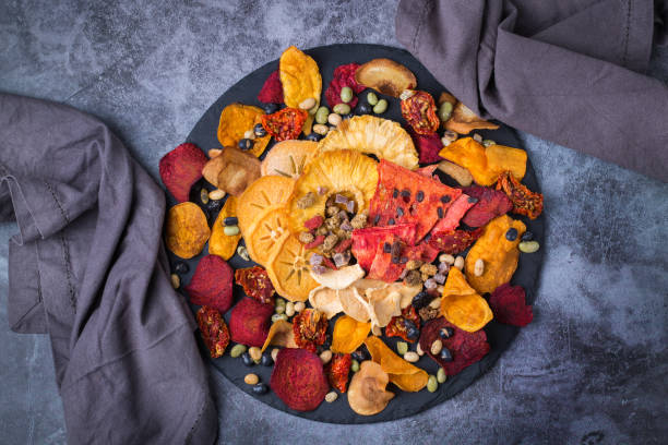 istock Dried fruits and vegetables, dehydrated persimmon, watermelon, pineapple, beetroot chips 1337362873