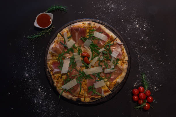 istock Pizza with prosciutto, parmesan, arugula/ pizza 1337370713
