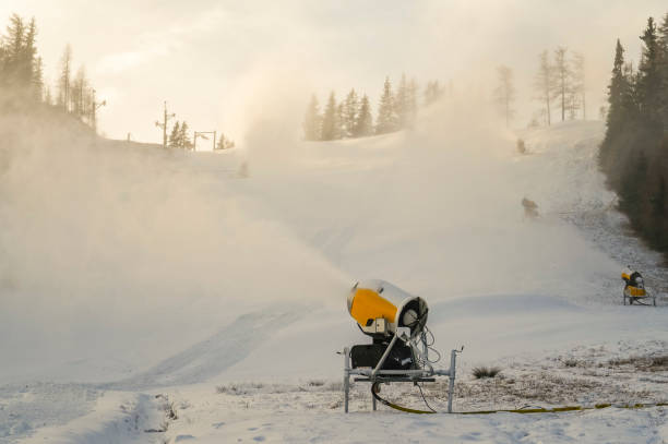 istock Snow cannon in winter mountains. Snow-gun spraying artificial ice crystals. Machine making snow. 1337370789