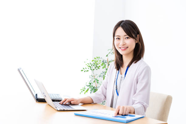 istock Young businesswoman doing paperwork in the office 1337371575