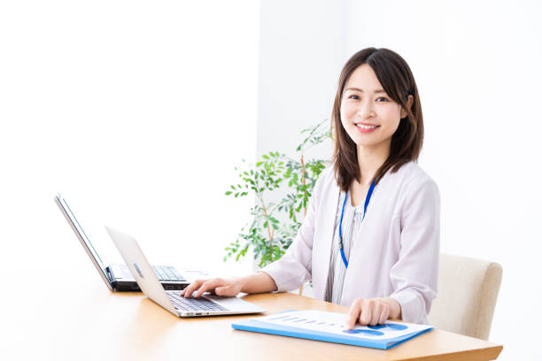 istock Young businesswoman doing paperwork in the office 1337371580