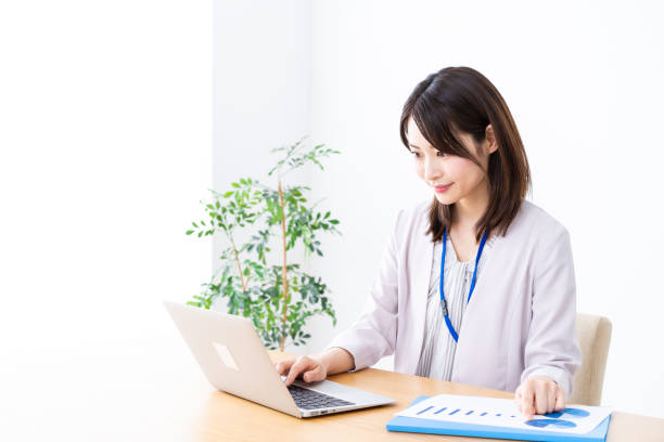 istock Young businesswoman doing paperwork in the office 1337371589