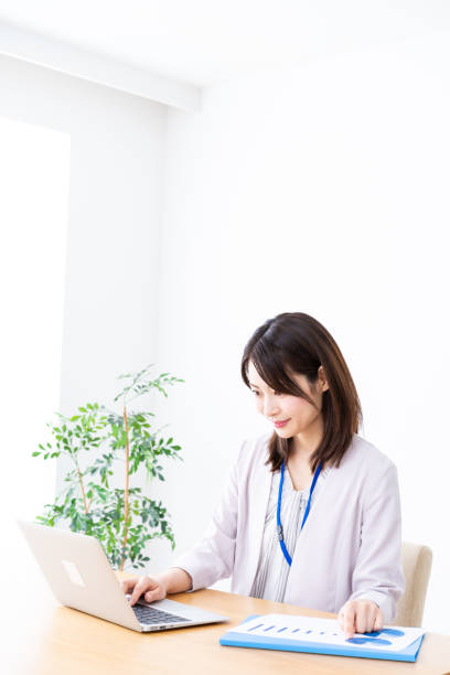 istock Young businesswoman doing paperwork in the office 1337371593