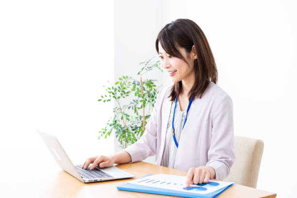 istock Young businesswoman doing paperwork in the office 1337371594