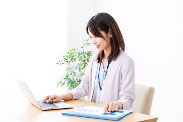istock Young businesswoman doing paperwork in the office 1337371595