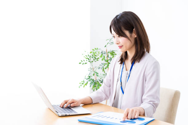 istock Young businesswoman doing paperwork in the office 1337371596