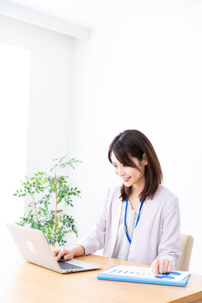 istock Young businesswoman doing paperwork in the office 1337371598