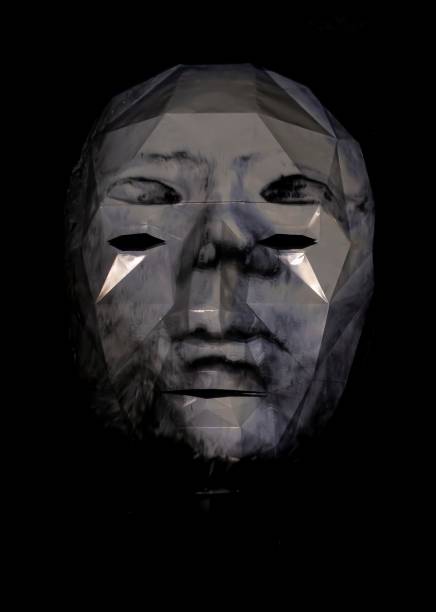 istock Abstract person face. Human head isolated on black background. Depersonalization and consciousness. Inorganic life concept 1337373247