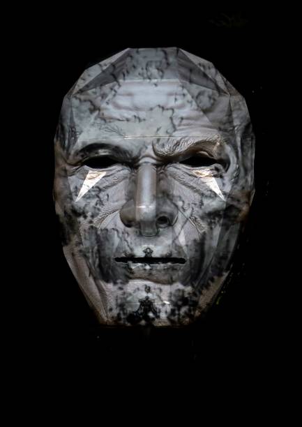 istock Abstract person face. Human head isolated on black background. Depersonalization and consciousness. Inorganic life concept 1337373327