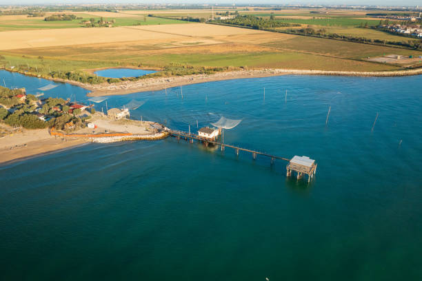 drone view of fishing huts - comacchio bildbanksfoton och bilder