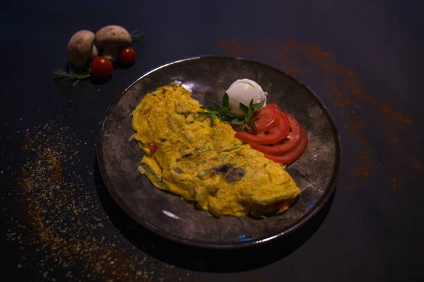 Fancy and luxurious omelette breakfast served at a high end restaurant top down view.