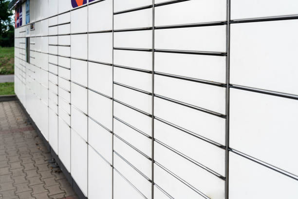 istock Delivery locker. Post automat terminal and hands with parcel courier box. Online purchase delivery service concept. 1337375017