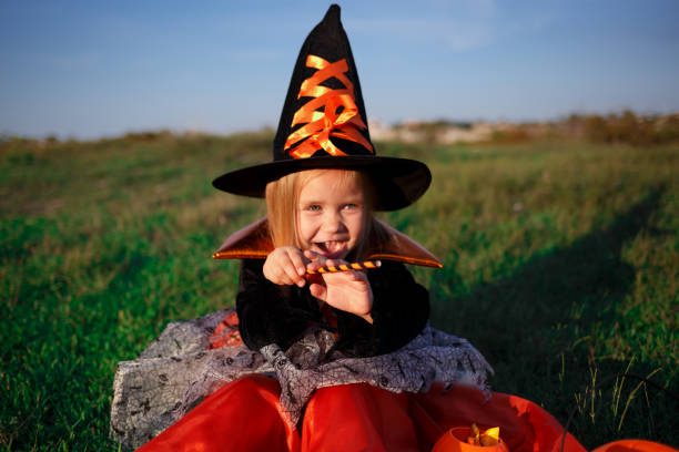 istock little cute girl dressed as a witch celebrates halloween 1337375170