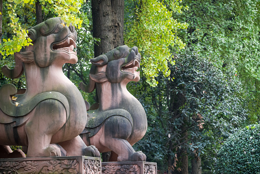 Two dragon son statues in a QingYangGong taoist temple Chengdu, Sichuan province, China
